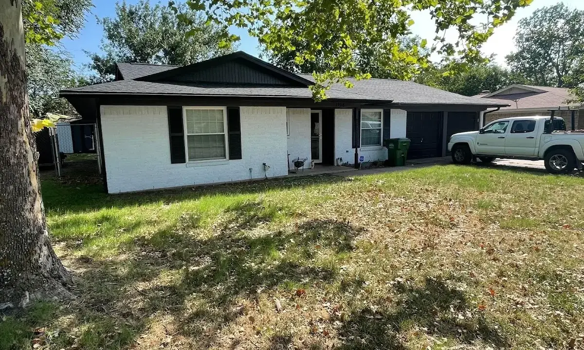 Professional roofing crew working on a residential roof in Peachtree City